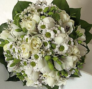 Wedding gift flowers arrangement made of  freesia, tulips, santini, alstroemeria, wax-flower